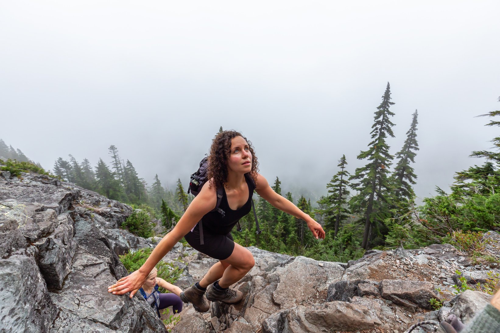 Adventurous Young Women Hiking In The Mountains